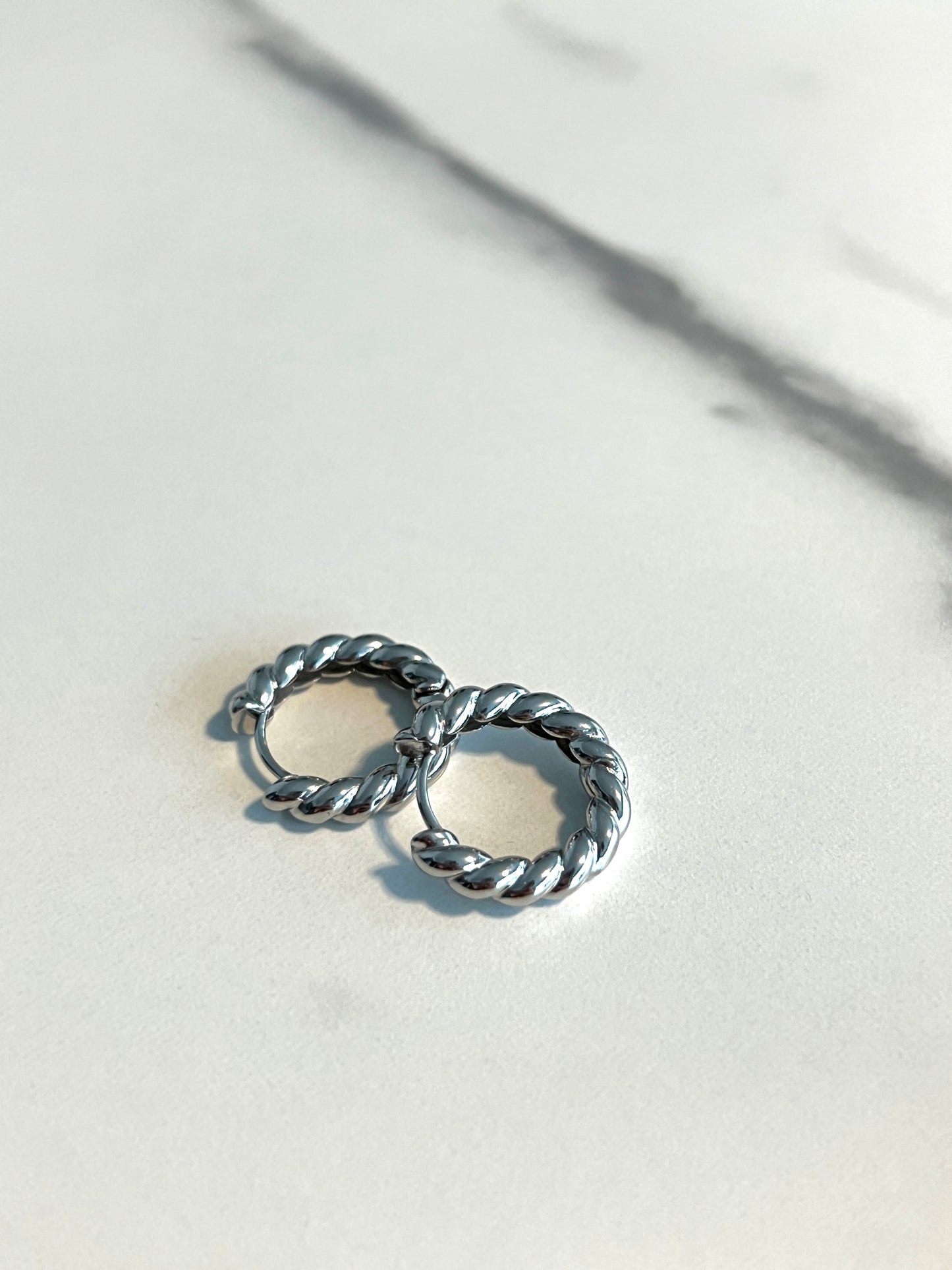 Small twisted silver hoops