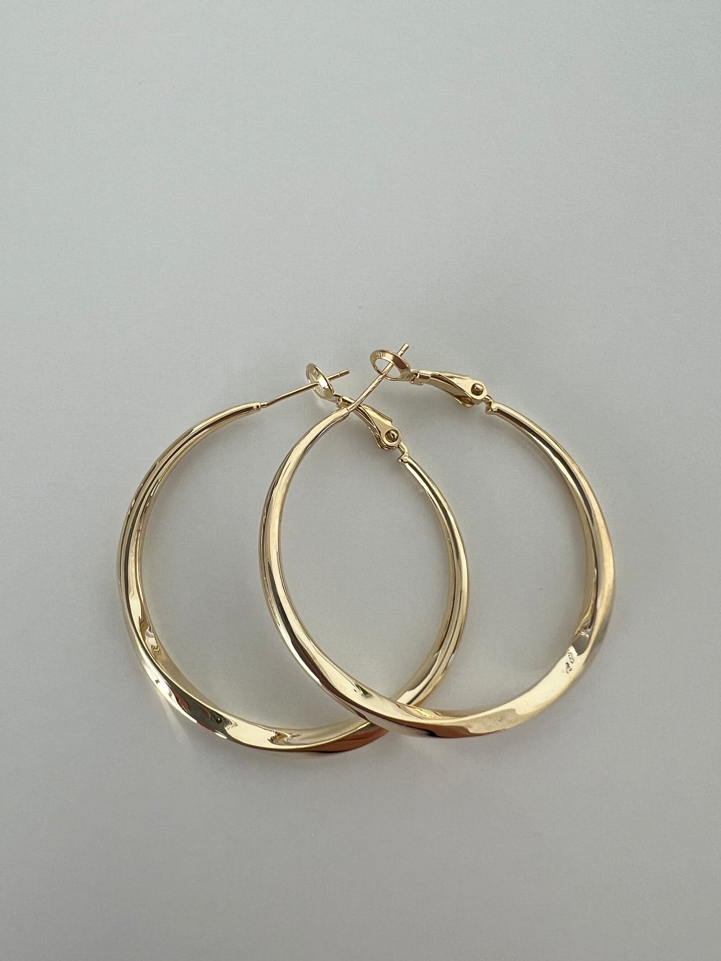 Golden twisted hoops