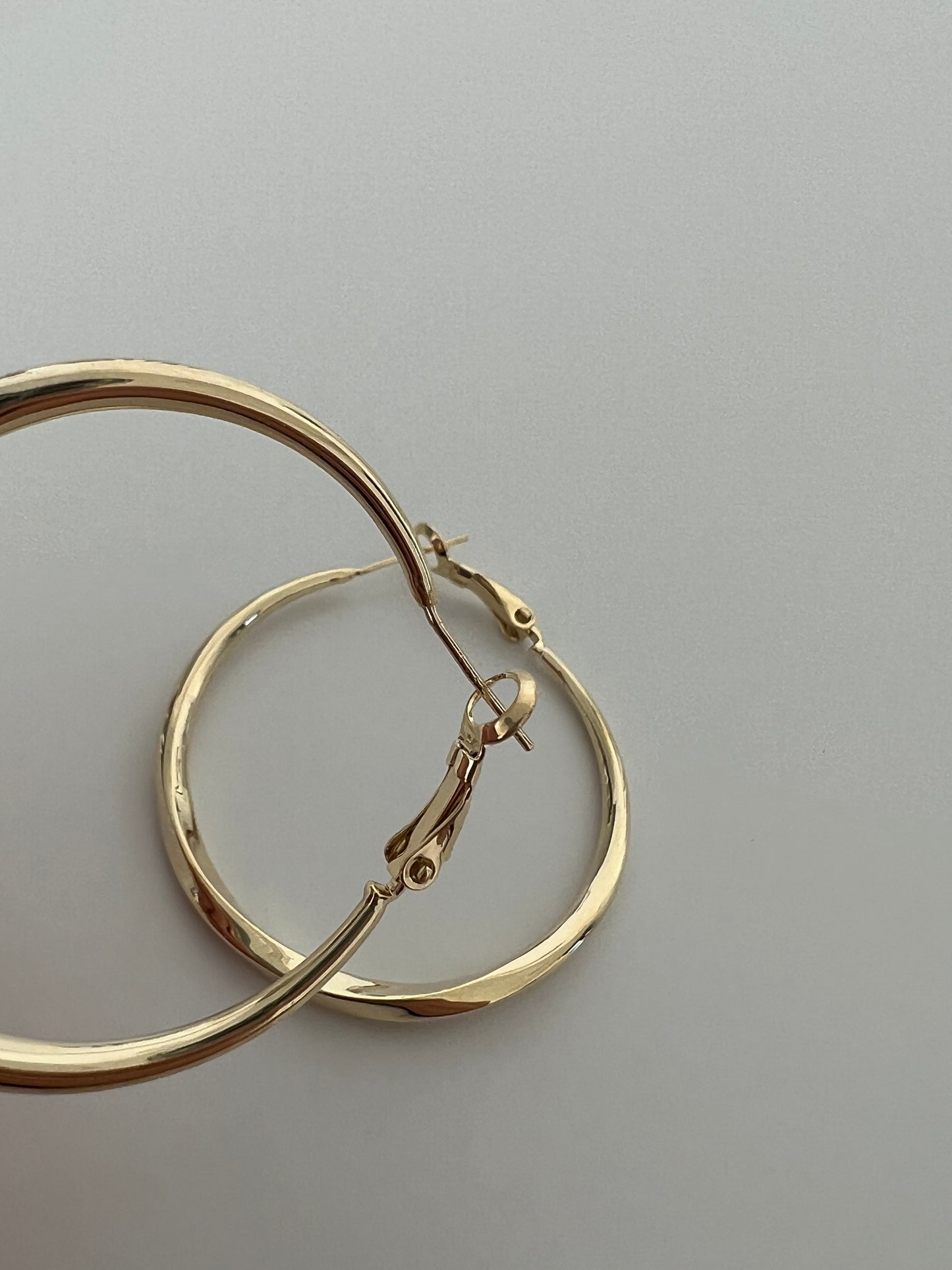 Golden twisted hoops